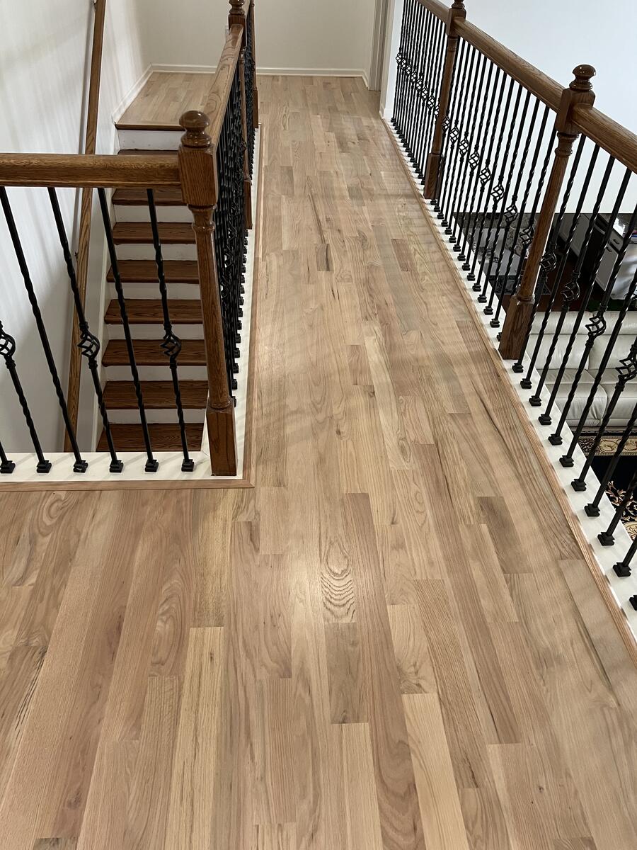 Light hardwood floor on staircase landing