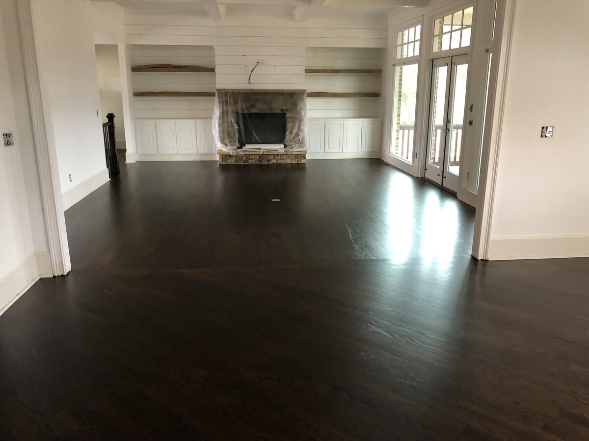 Dark hardwood floor with fireplace