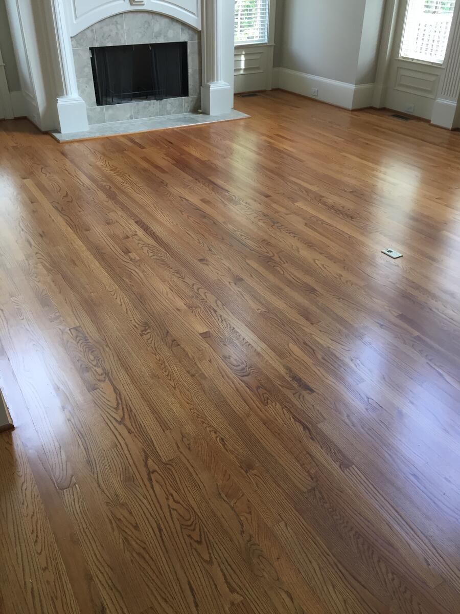 Golden oak hardwood floor with fireplace